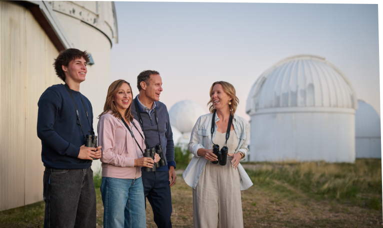 Students standing together near a white dome building