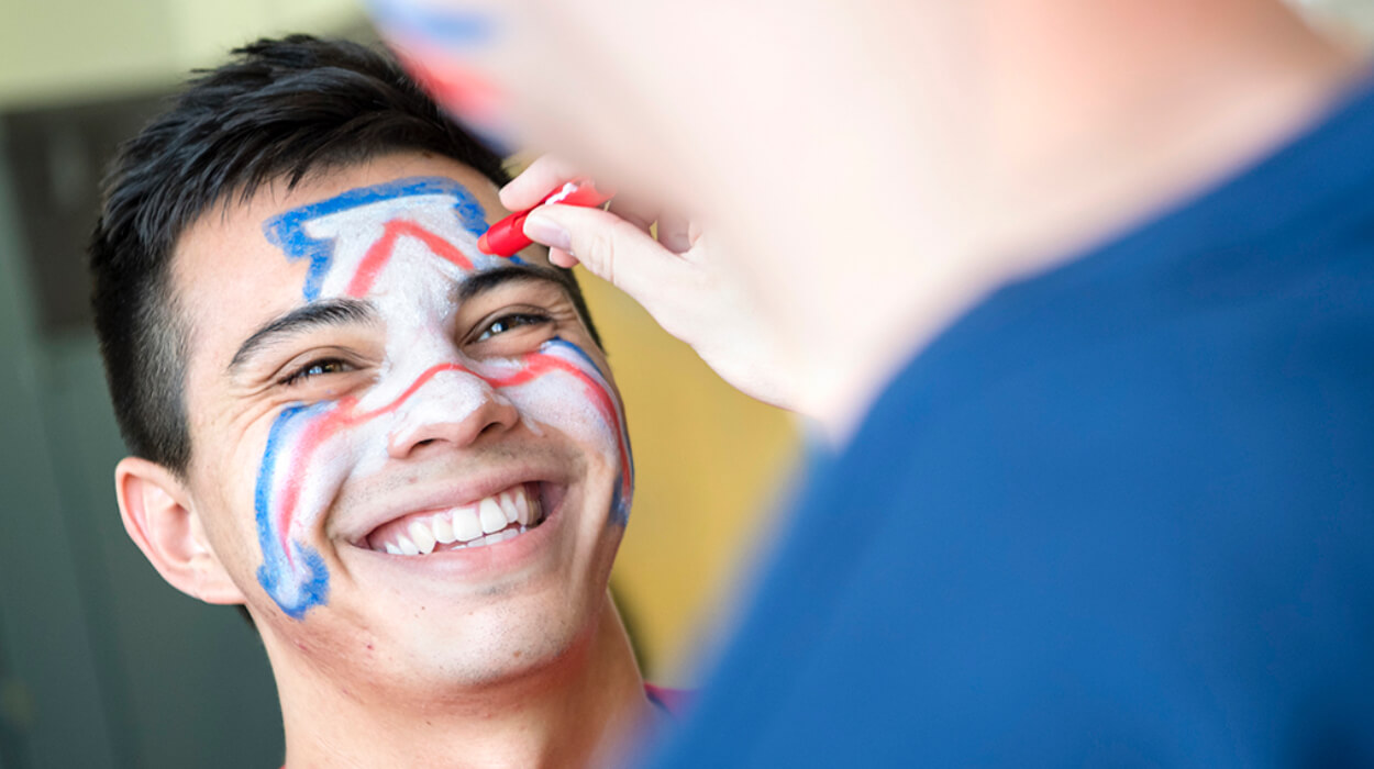 University of Arizona student with Block A paint on face.