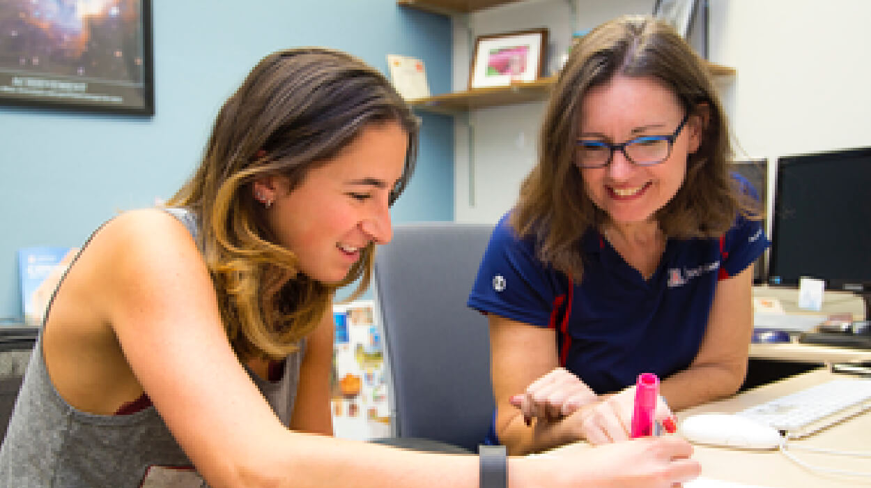 University of Arizona professor and student reviewing project.